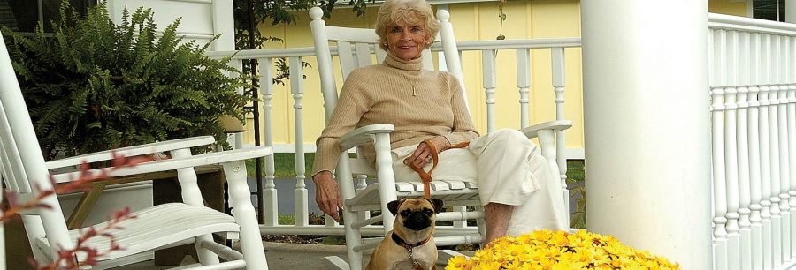 Woman on porch with dog